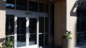 A modern building with a sign reading "BANITE" and the address "1840".