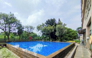 Outdoor pool - Homey 2Br Furnished Apartment At The Edge Bandung (Cimahi)