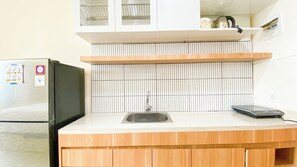 Standard Apartment | Private kitchen | Fridge, stovetop