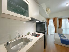 Standard Apartment | Private kitchen - Cozy And Best Deal Studio Apartment Grand Dhika City (Bekasi)
