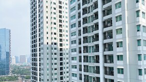 A high-rise building with multiple floors, large windows, and balconies. - Good Deal And Restful 1Br At Apartment Thamrin Residence (Jakarta)