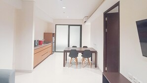 A modern kitchen with a dining area. - Modern 2Br (No Kitchen) Apartment Skales Residence Nusa Dua Bali (Nusa Dua)