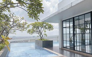Outdoor pool - 2Br Luxurious And Spacious Apartment At One East Penthouse Residence (Surabaya)