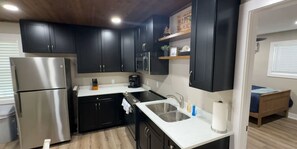 Fridge, microwave, oven, stovetop - Cedar Lodge Retreat at Fish & Fiddle Family Resort & Extended Stay (Mountain Home)