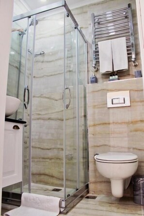 Shower, hair dryer, towels, soap