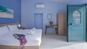 A bedroom with a bed, a desk, a wardrobe, and a door. - M City Apartments | Garden 2 | 100m from the beach (Chania)