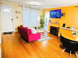 TV, fireplace - Cozy 2BER Home Near Commonwealth Stadium (Edmonton)