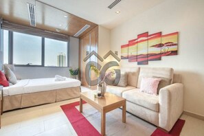 Studio, 1 Bedroom, Balcony, City View | Living area - Restful Studio Apartment in Dubai Sports City (Dubai)