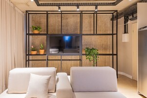 Design Apartment | Living area | Flat-screen TV