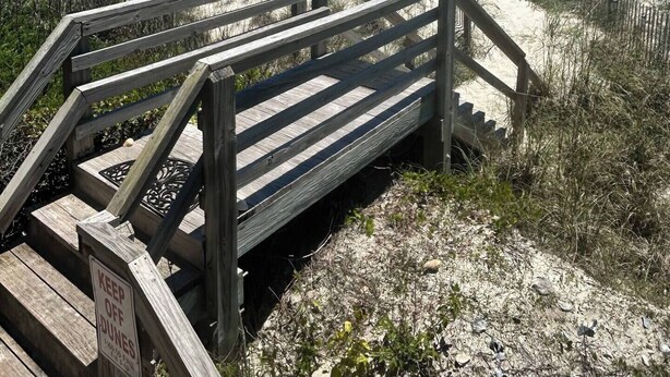 A wooden staircase leading to a beach with a clear view of the ocean. - Just For The Halibut 
Ocean Front Stay
Pet-Friendly (Emerald Isle)