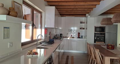 Family country house with swimming pool and open-plan kitchen.