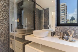 Shower, hair dryer, towels, soap