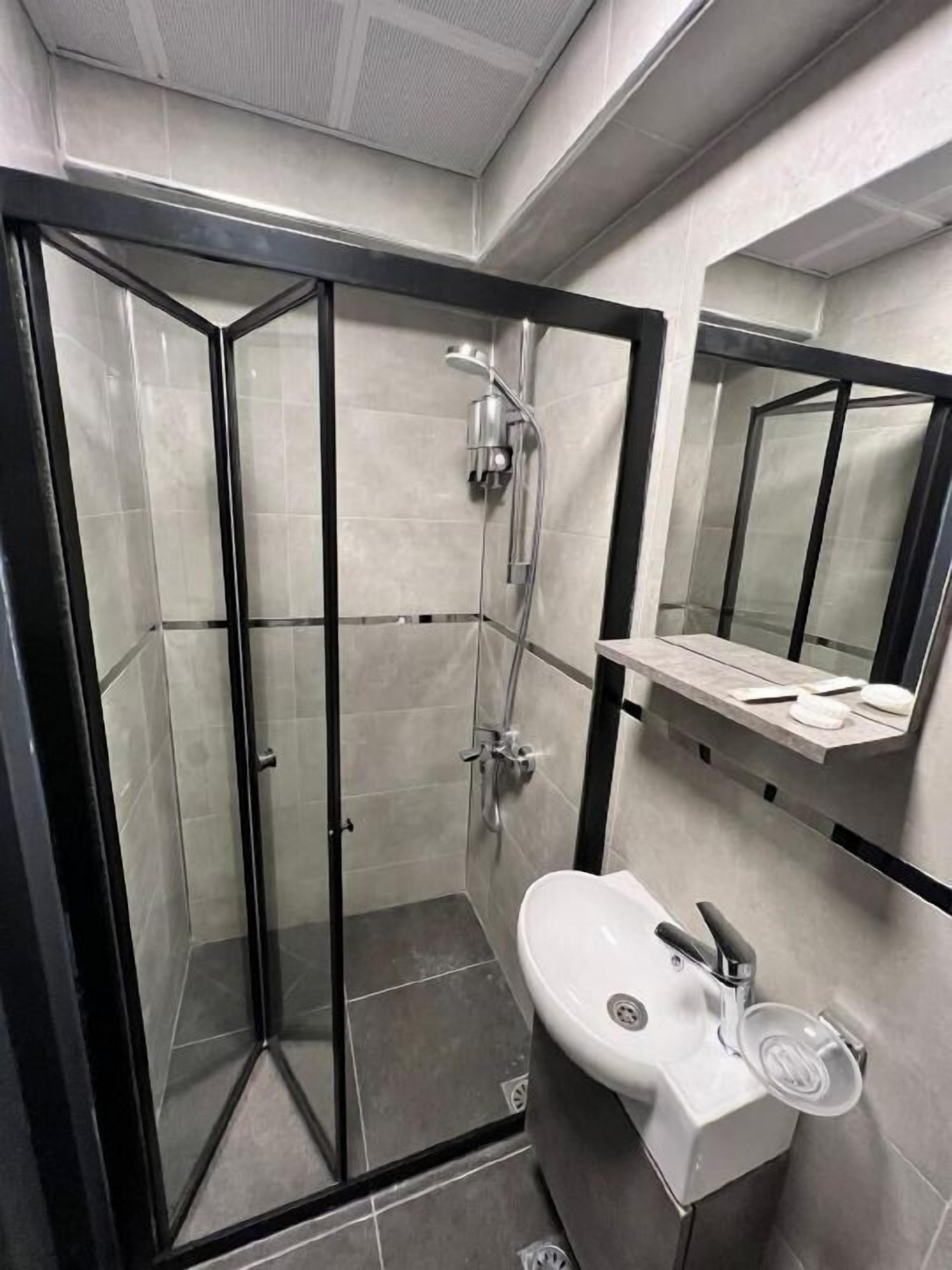 Shower, hair dryer, slippers, towels