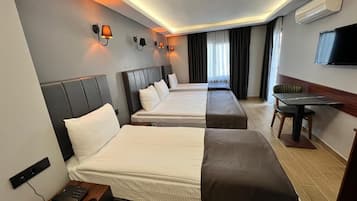 Family Quadruple Room | Minibar, laptop workspace, free WiFi