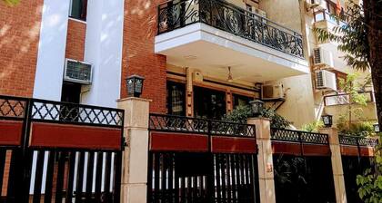 Premium 3-bedroom apartment with Air purifiers, AC, WiFi in Green Park Delhi