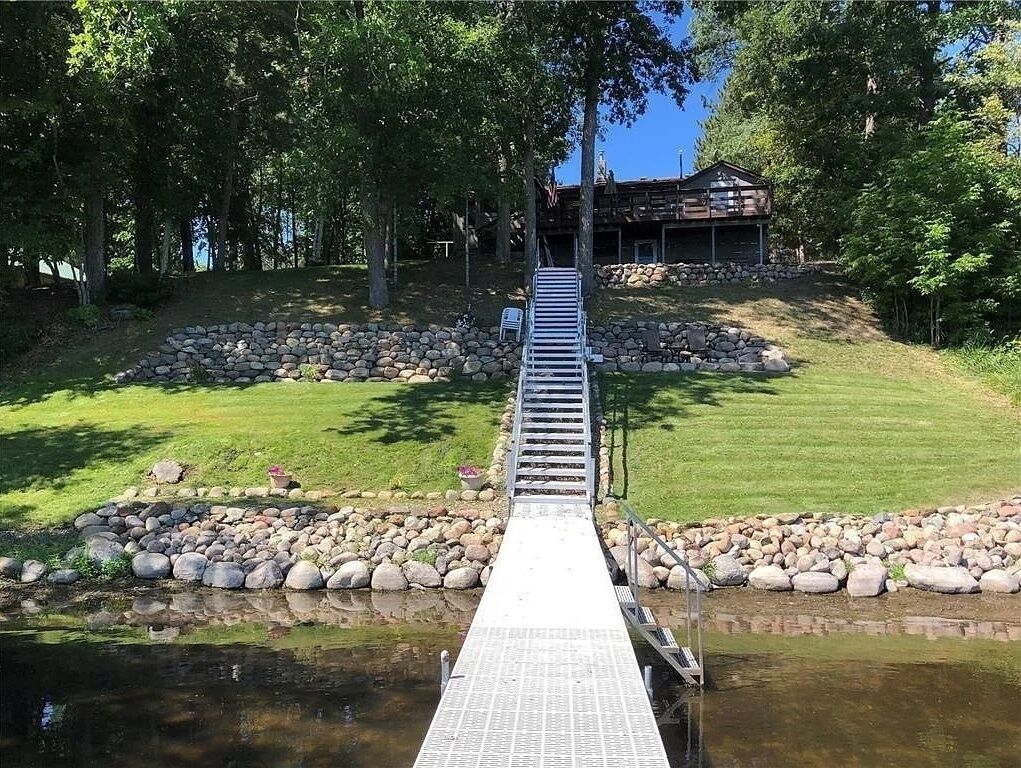 View of the cabin from the dock. Great lake views from the deck. 