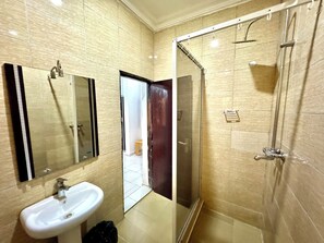 Shower, eco-friendly toiletries, towels, soap