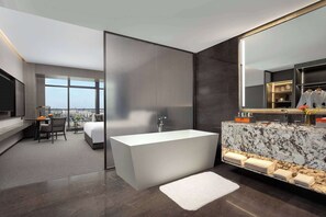 Grand Room, 1 King Bed | Bathroom | Separate tub and shower, rainfall showerhead, designer toiletries - Wyndham Grand Chengdu East (Chengdu)