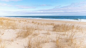 A beach with sand dunes and a clear sky. - Bayfront Coastal Paradise | Pool | Beach Access (Bethany Beach)