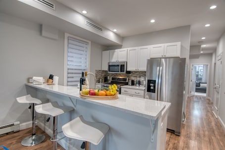 Fridge, microwave, oven, stovetop. Elegant 2BR Modern Oasis Brand-New Build, Luxe Touches & Lightning-Fast WiFi, AC