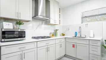 Fridge, microwave, stovetop, coffee/tea maker
