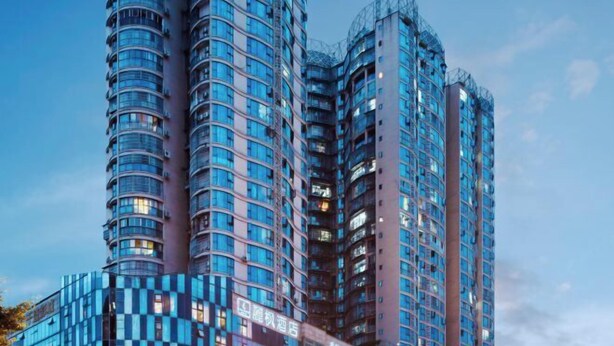 A high-rise building with multiple balconies and a modern architectural design. - Lavande Hotel (Suining Heping West Road) (Suining)