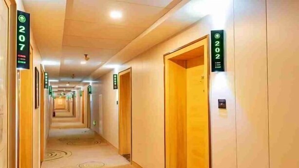 A hotel corridor with doors numbered 207 and 202, leading to rooms. - Light Living City Preferred Hotel (RT-Mart) (Jiyuan)