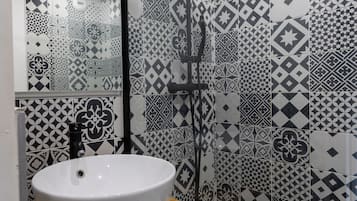 Shower, towels, soap, toilet paper