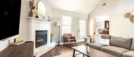 Smart TV, fireplace, books, offices