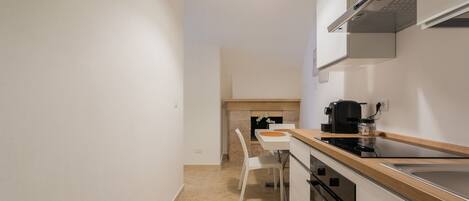 Fridge, stovetop, coffee/tea maker, cookware/dishes/utensils