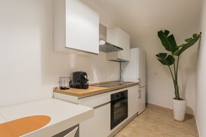 Fridge, stovetop, coffee/tea maker, cookware/dishes/utensils