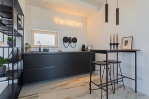 Fridge, microwave, stovetop, coffee/tea maker