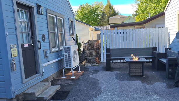A backyard with a fire pit, outdoor furniture, and a covered grill. - "Oreo’s Dream – A Cozy, Dog-Lover’s Retreat!" (Geneva)