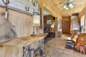 A wooden interior with a bar area, a staircase, and a rustic decor. - NEW LISTING !!! RUSTIC MEADOW AT LADYBUG LAKE (Morganton)