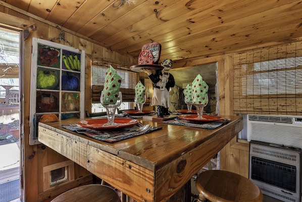 A wooden interior with a bar area, a window with a view, and a decorative fruit display. - NEW LISTING !!! RUSTIC MEADOW AT LADYBUG LAKE (Morganton)