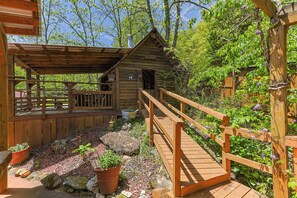 A wooden cabin with a porch and a wooden deck. - NEW LISTING !!! RUSTIC MEADOW AT LADYBUG LAKE (Morganton)