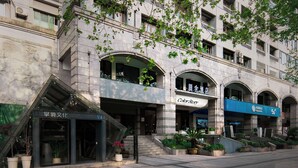 A multi-story building with a storefront labeled "Color Story." - Colorstory Hotel (Hangzhou)