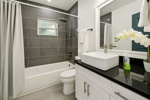 Shower, hair dryer, towels, soap - 4-bedroom bungalow near downtown Tampa. (Tampa)