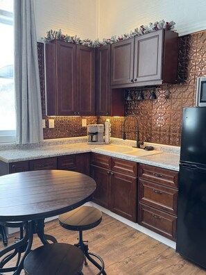 Fridge, microwave, coffee/tea maker, dining tables