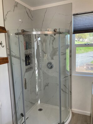 Shower, hair dryer, towels, soap