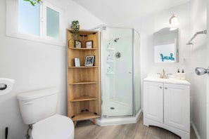 Shower, hair dryer, towels, shampoo