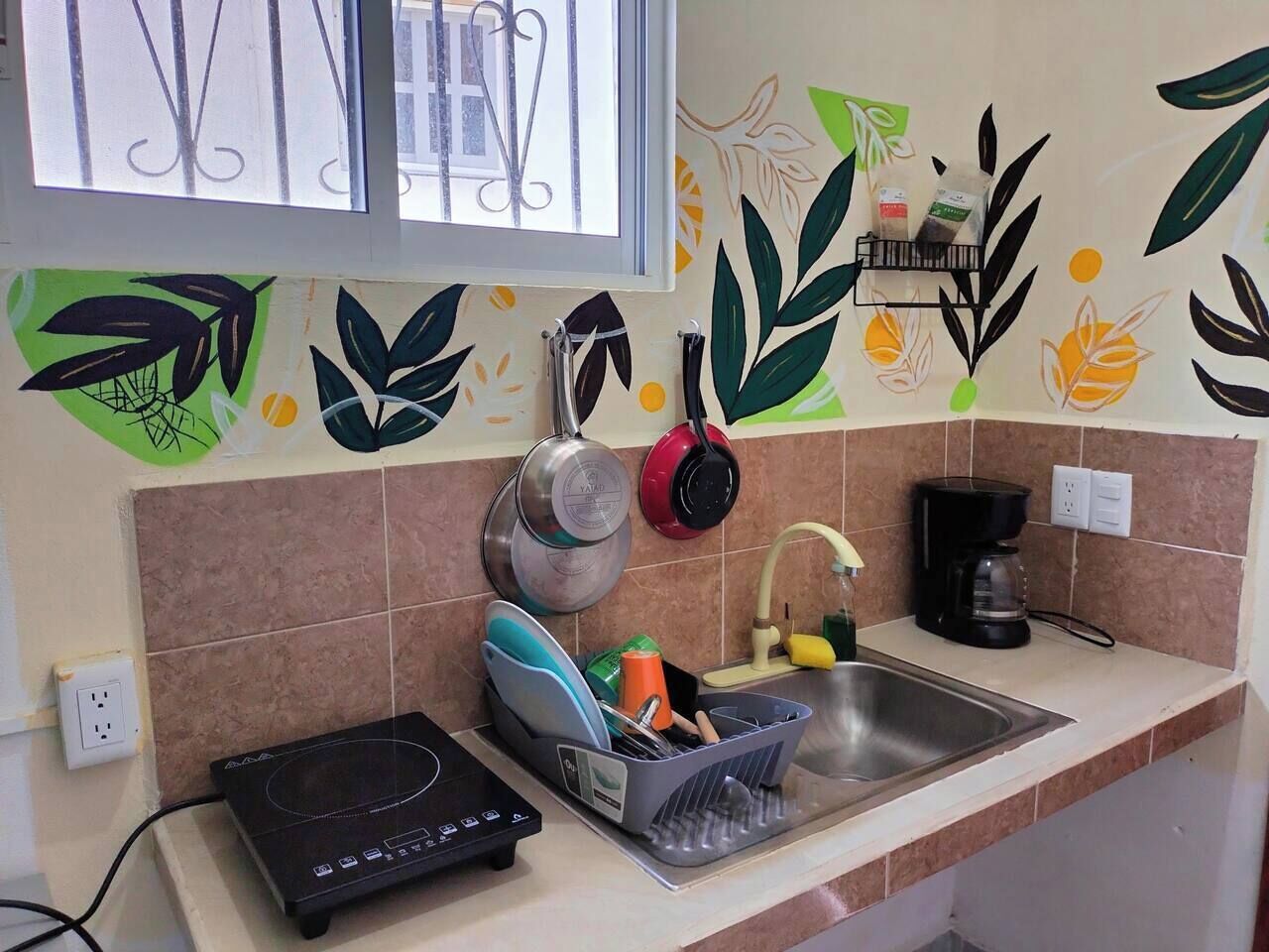 Fridge, stovetop, coffee/tea maker, cookware/dishes/utensils