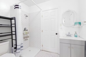 Shower, hair dryer, towels, soap