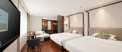 A hotel room with two beds, a desk, a chair, a TV, and a decorative wall panel.