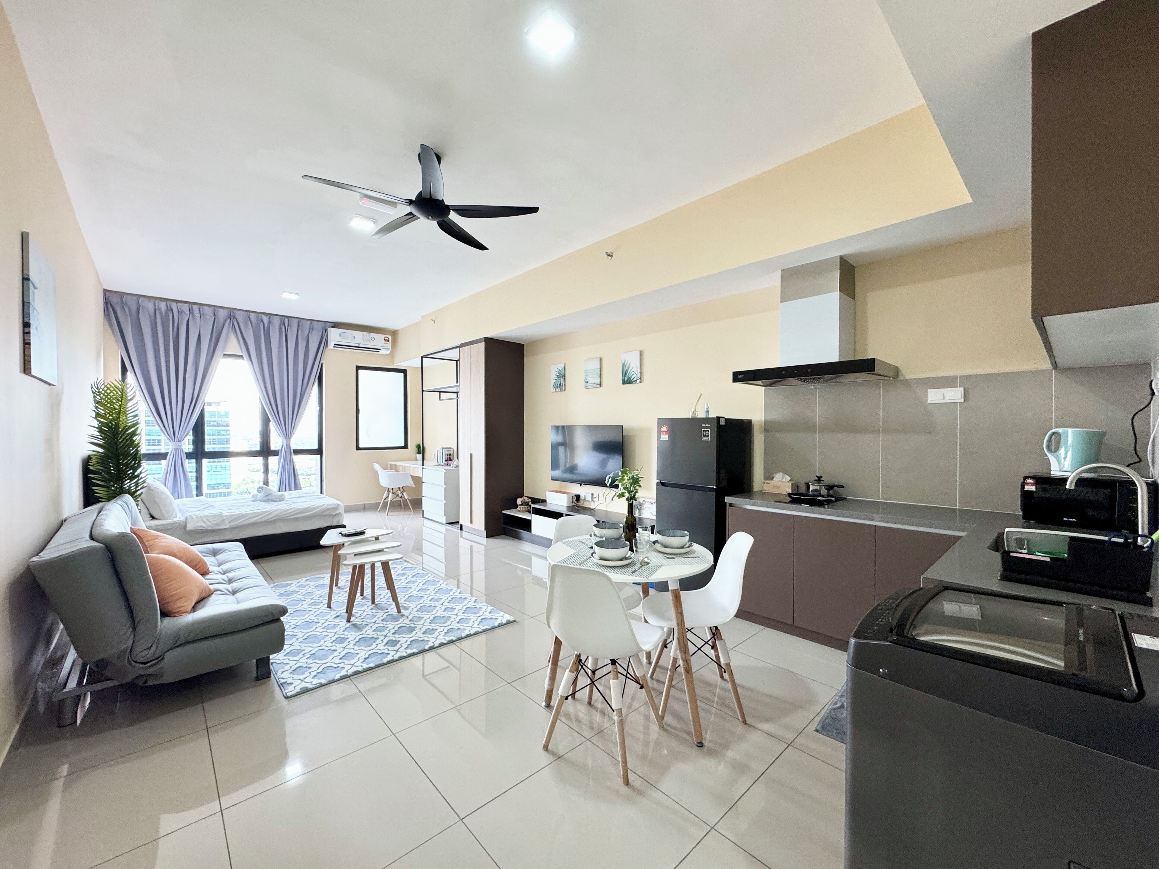 A modern apartment with a living room, dining area, kitchen, and a balcony.