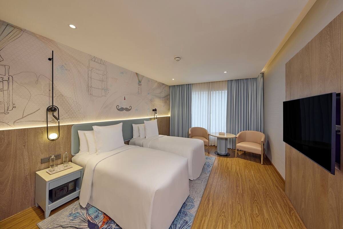Habitación Premier con 2 camas individuales | Ropa de cama de alta calidad, edredones de plumas, minibar y caja fuerte