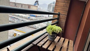 Comfort Room, Balcony | Desk, laptop workspace, blackout drapes, free WiFi - Seaside Suites (Naples)