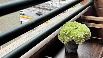 Deluxe Triple Room, Balcony, Partial Sea View | Desk, laptop workspace, blackout drapes, free WiFi