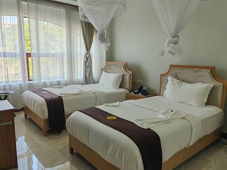 Deluxe Double or Twin Room, City View | 1 bedroom, in-room safe, laptop workspace, blackout drapes