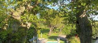 CHARMING FARMHOUSE WITH WOODED GROUNDS AND SWIMMING POOL